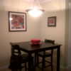 Small dining table in corner of room