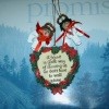 A heart shaped Christmas ornament hanging with two noodle angels over a calendar that says "Promise".