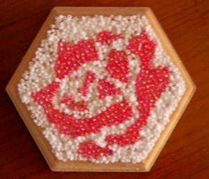 view of box top with white beads added to complete design