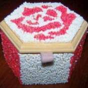 completed pink and white seed bead box with felt loop attached
