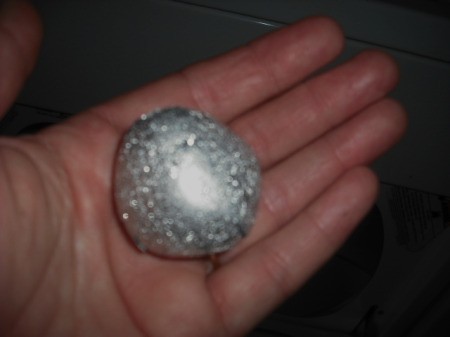 A ball of aluminum foil to prevent static in the dryer.