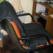 A heating/massage pad on an office chair.