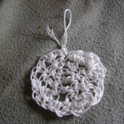 White crocheted pot scrubber