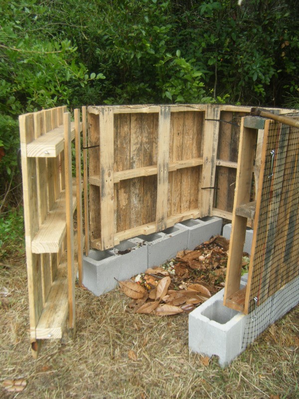 Compost bin made from pallets with door open