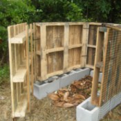 Compost bin made from pallets with door open