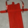 red painted sled with cross member and ribbon pull tied on