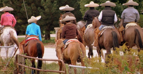 men on horseback in sombreros