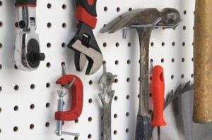 Photo of tools hung a peg board.