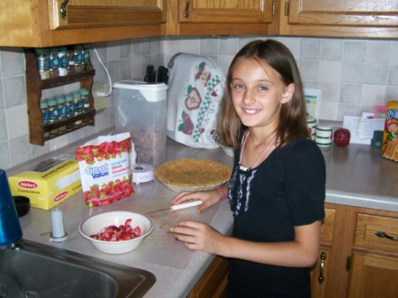 Grand-daughter Hayley preparing strawberry pie