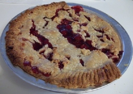 A smiling cherry pie.