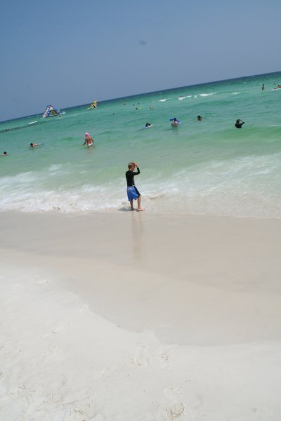 People in water and on beach.