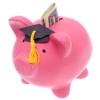 Pink piggy bank wearing graduation cap with money in the slot.