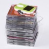 Stack of CDs and an MP3 player on top.