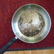 photo of interior of burned stainless steel frying pan