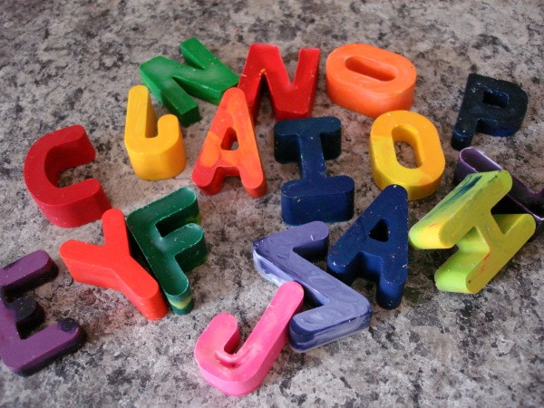 Alphabet crayons on counter