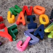 Alphabet crayons on counter