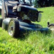 photo of a lawn mower mowing grass