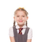 Girl in a grey school uniform.