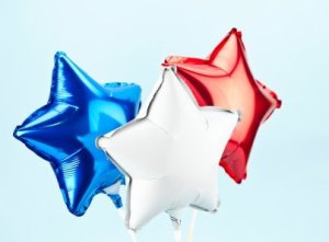 Photo of three star shaped mylar balloons.