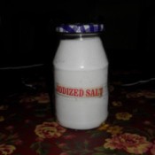 A jar of salt in a Smuckers jelly jar.