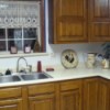 Corner photo in new kitchen of counter with rooster decoration.