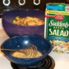 Betty Crocker Suddenly Salad box with bowl of mixed salad and bowl of dressing