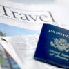 Passport ontop of a travel newspaper page