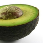 A ripe avocado cut in half.