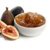 A bowl of fig jam and some fresh figs.