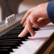 Closeup of a woman playing keyboard