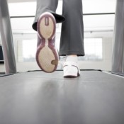 Woman's Feet Running on Treadmill