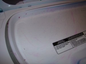 Picture of crayon stains on a dryer door.