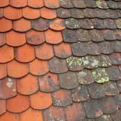 A dirty roof that has been partially cleaned.