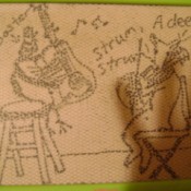 Magnadoodle drawing of a rooster playing dueling guitars with a deer