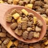 Dried Pet Food and Wooden Spoon
