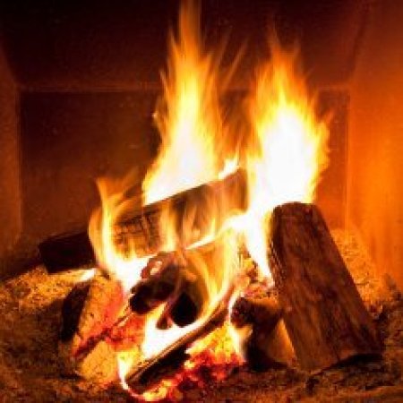 Logs burning in a fireplace.