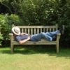 Man snoozing on garden bench