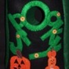 Black treat bag with green letters spelling out spooky and jack-o-lanterns.