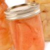 Grapefruit slices in a canning jar.