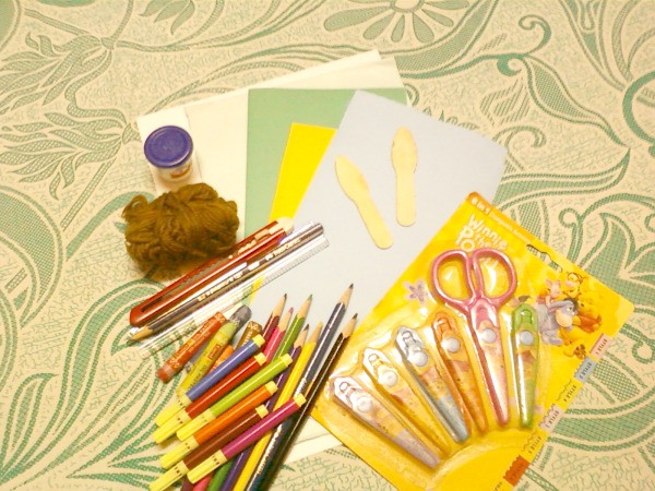 Sister card making supplies laid out on a table.
