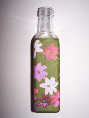second side of bath salt bottle with flowers applied to green paper wrapped around it