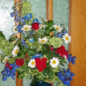 Bouquet of Red, White and Blue Flowers in a Blue Vase