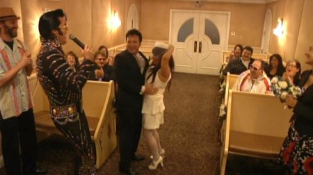 Elvis Impersonator Singing to Bride and Groom