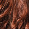 Up close photo of red, wavy hair.