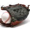A baseball glove with a baseball.