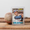Vintage Hank Aaron Baseball Card Leaning Against Old Baseball