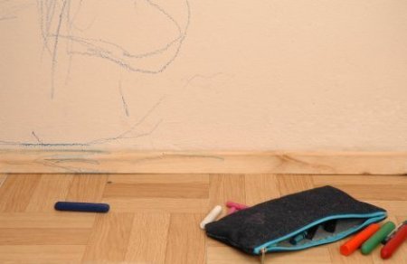 Crayon marks on a wall.