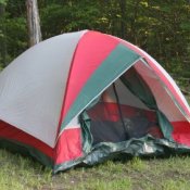 Photo of a tent set up in the woods.