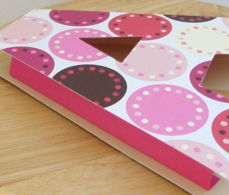Patterned cut out of the letter A on top of the smaller pink cutout