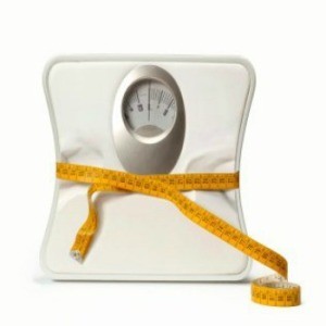 Inexpensive Ways to Lose Weight, Scale being cinched in by a tape measure.
